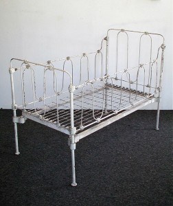 Here's an antique iron baby crib, like many cribs lurking in relative's basements and attics. Does it meet current safety standards. That would be a big fat NO!