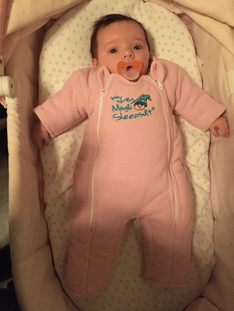 baby rolling over in merlin sleepsuit